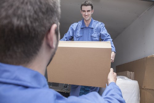 Moving team planning a local relocation in Acton with boxes and furniture