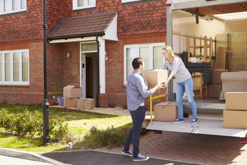 Man and van loading items for a move in Acton