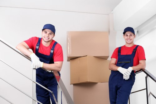 Furniture collection van and crew handling an Acton pick-up job