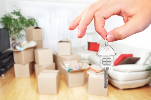 Commercial office moving team handling furniture in West London