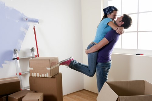 Helper loading household items into a van