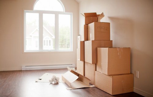 Loading furniture into a van for an Acton home or office relocation