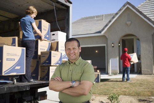 Packing and loading household belongings for a move in Acton