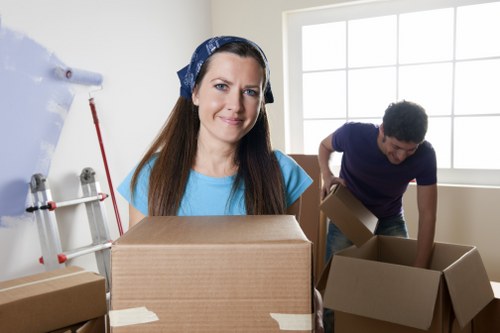 House removal team unloading items into a new home in Acton