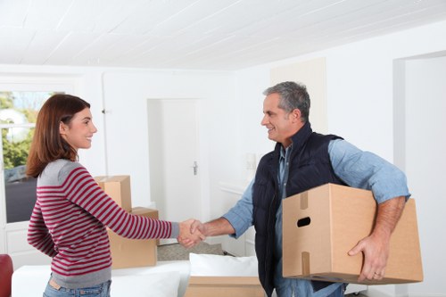 Packed boxes and furniture ready for removals in Acton