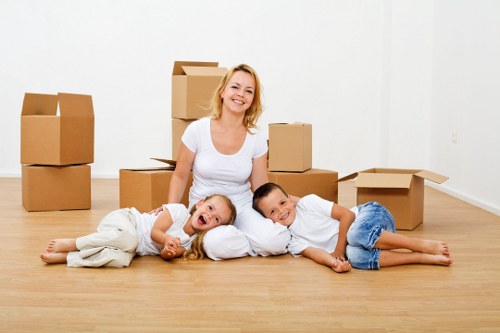 Careful loading of furniture for a home move in Acton
