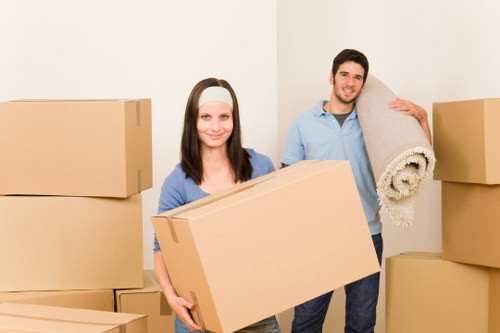 Local moving team handling boxes and furniture in Acton