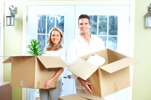Loading furniture into a moving truck for an Acton property move